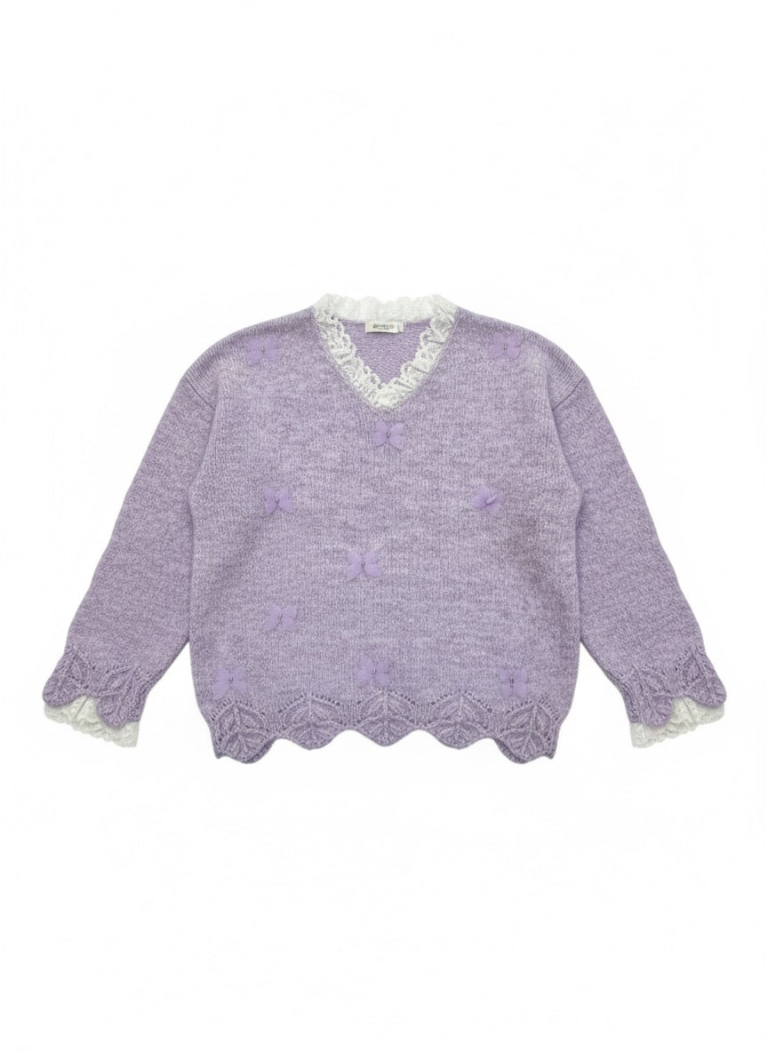lavender fuzzy knit sweater with a scalloped hem.