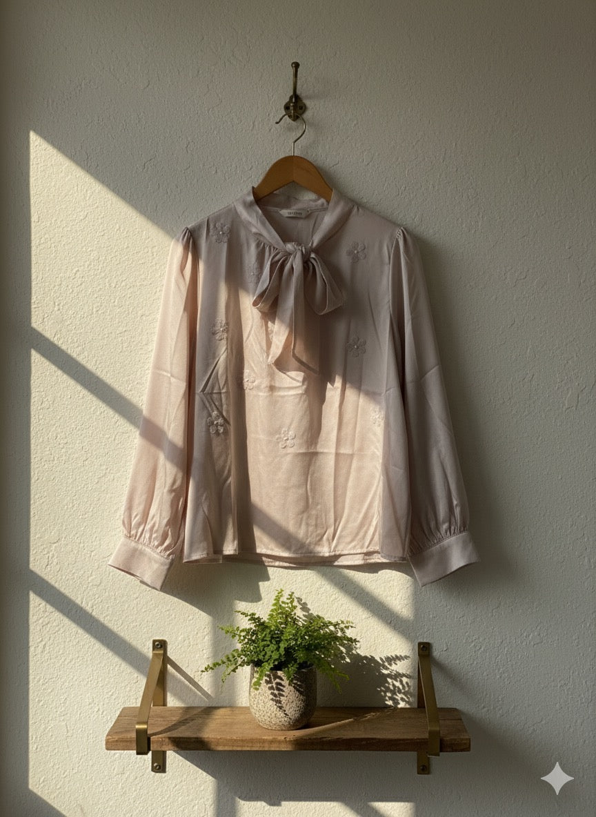 Embroidered Tie-Neck Blouse.