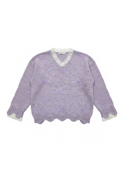 lavender fuzzy knit sweater with a scalloped hem.